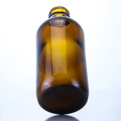 Bottiglia di birra di vetro vuota da 350 ml con tappo di seta a corona e stampaggio a caldo