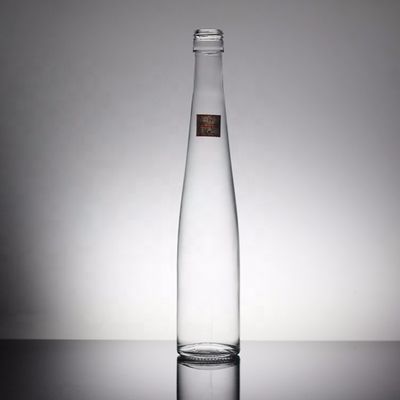Bottiglia di vetro di acqua minerale trasparente rotonda da 700 ml a 350 ml su misura per bevande industriali