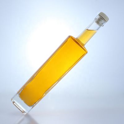 Bottiglia di vetro di liquore a forma rotonda di 700 ml con logo personalizzato e finitura a sughero