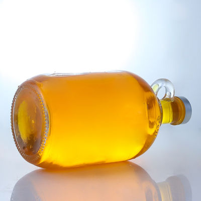 Logo personalizzato Bottiglia di vetro di liquore a forma rotonda con manico e tappo a vite
