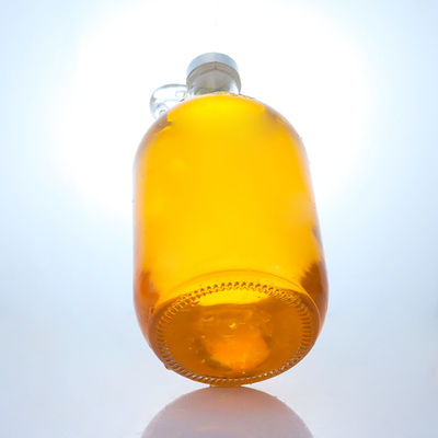 Logo personalizzato Bottiglia di vetro di liquore a forma rotonda con manico e tappo a vite